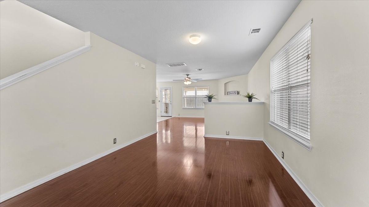 527 Cypresswood Knoll Spring, TX 77373 - Photo 13 of 45 a kitchen with a wooden floor and a window