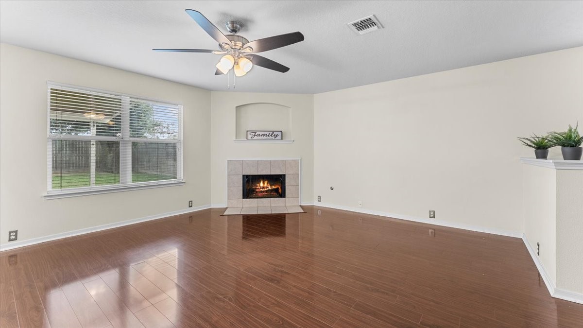 527 Cypresswood Knoll Spring, TX 77373 - Photo 15 of 45 a view of empty room with wooden floor and fan