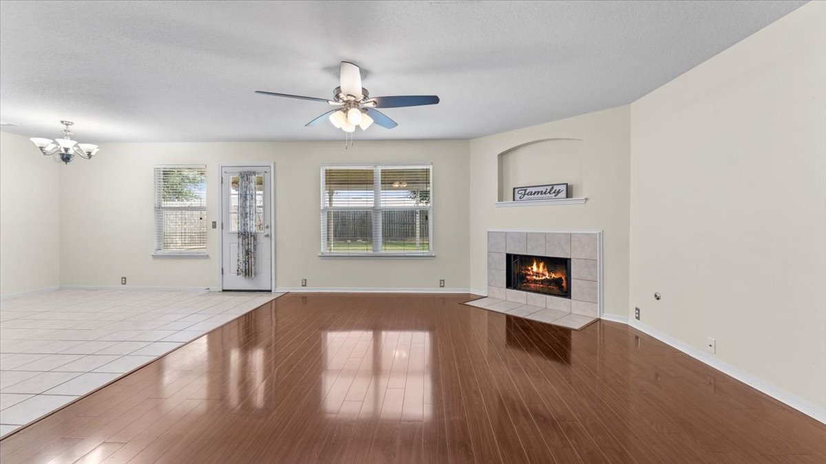 527 Cypresswood Knoll Spring, TX 77373 - Photo 18 of 45 a view of livingroom with fireplace wooden floor and window