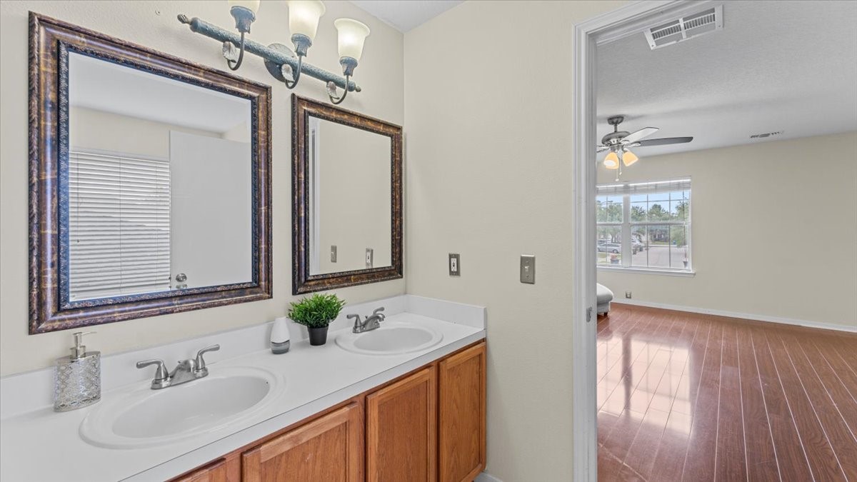 527 Cypresswood Knoll Spring, TX 77373 - Photo 30 of 45 a bathroom with a sink and a mirror