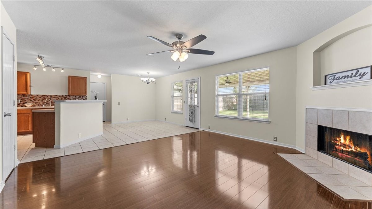 527 Cypresswood Knoll Spring, TX 77373 - Photo 33 of 45 a view of a kitchen with wooden floor and a fireplace