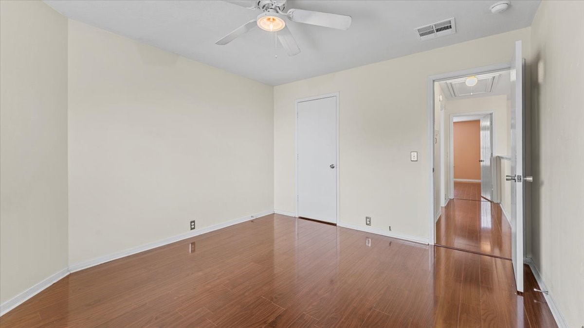 527 Cypresswood Knoll Spring, TX 77373 - Photo 37 of 45 an empty room with wooden floor and mirror