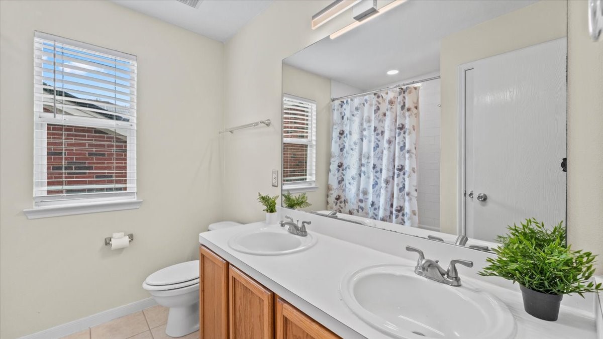 527 Cypresswood Knoll Spring, TX 77373 - Photo 39 of 45 a bathroom with a sink toilet and shower