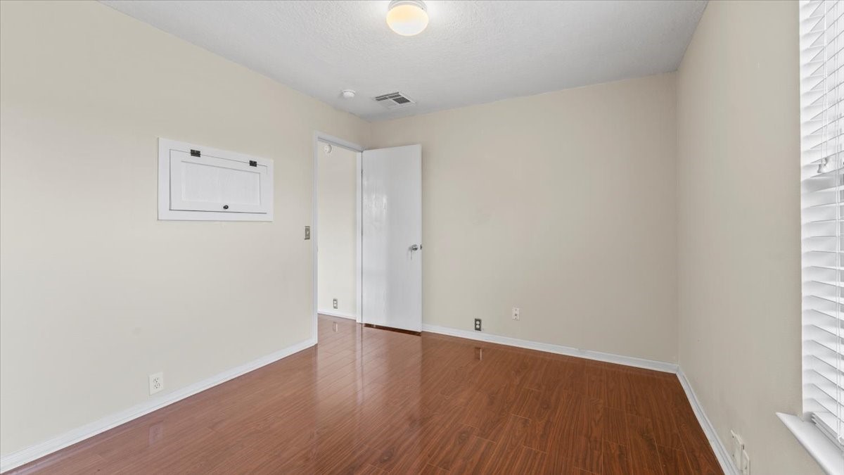 527 Cypresswood Knoll Spring, TX 77373 - Photo 44 of 45 an empty room with wooden floor and windows