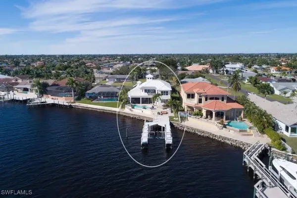 an aerial view of a house with a ocean view