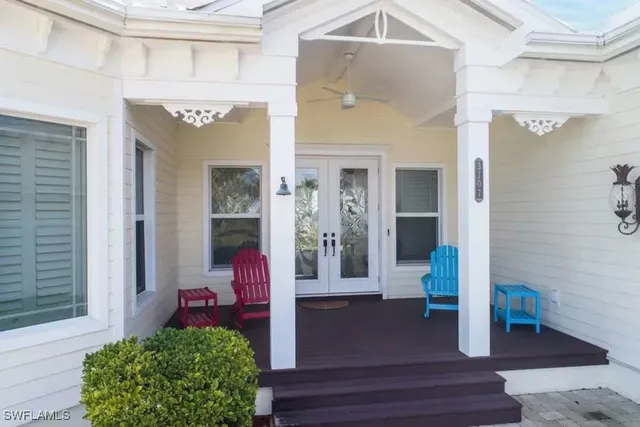 a front view of a house with outdoor seating