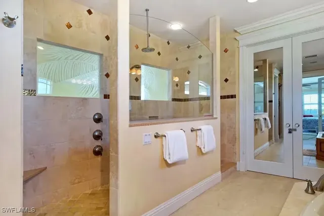a bathroom with a shower and a sink