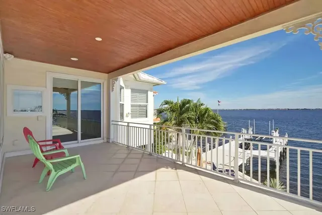 a view of a chairs and table in patio