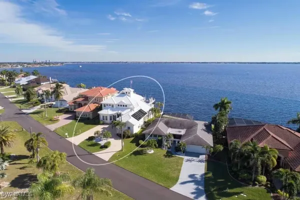 an aerial view of a house with a swimming pool