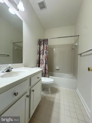 a bathroom with a bathtub a sink and a shower