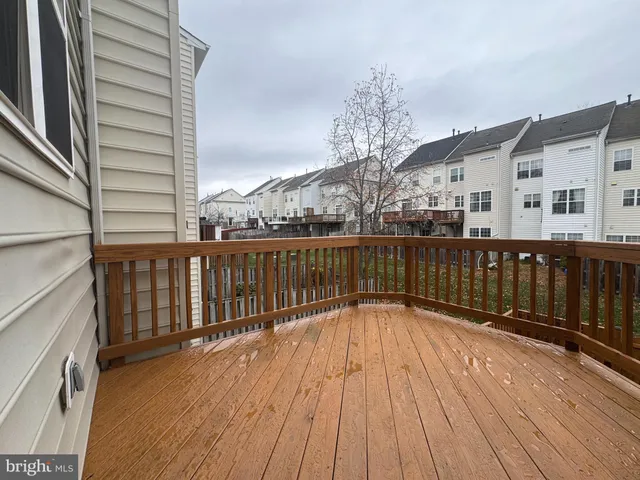 a view of wooden balcony with wooden floor