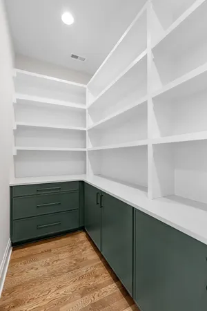 a room with closet and wooden floor