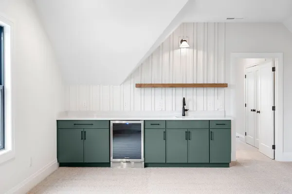 a kitchen with a sink and cabinets