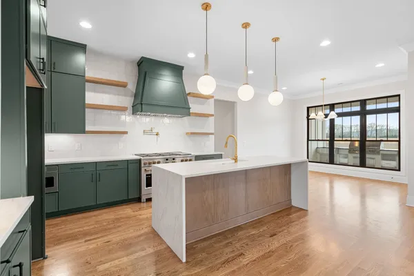 a kitchen with a sink and stove