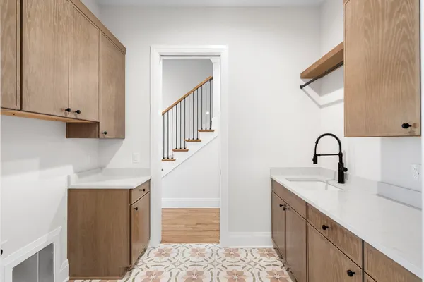 a kitchen with a sink and cabinets