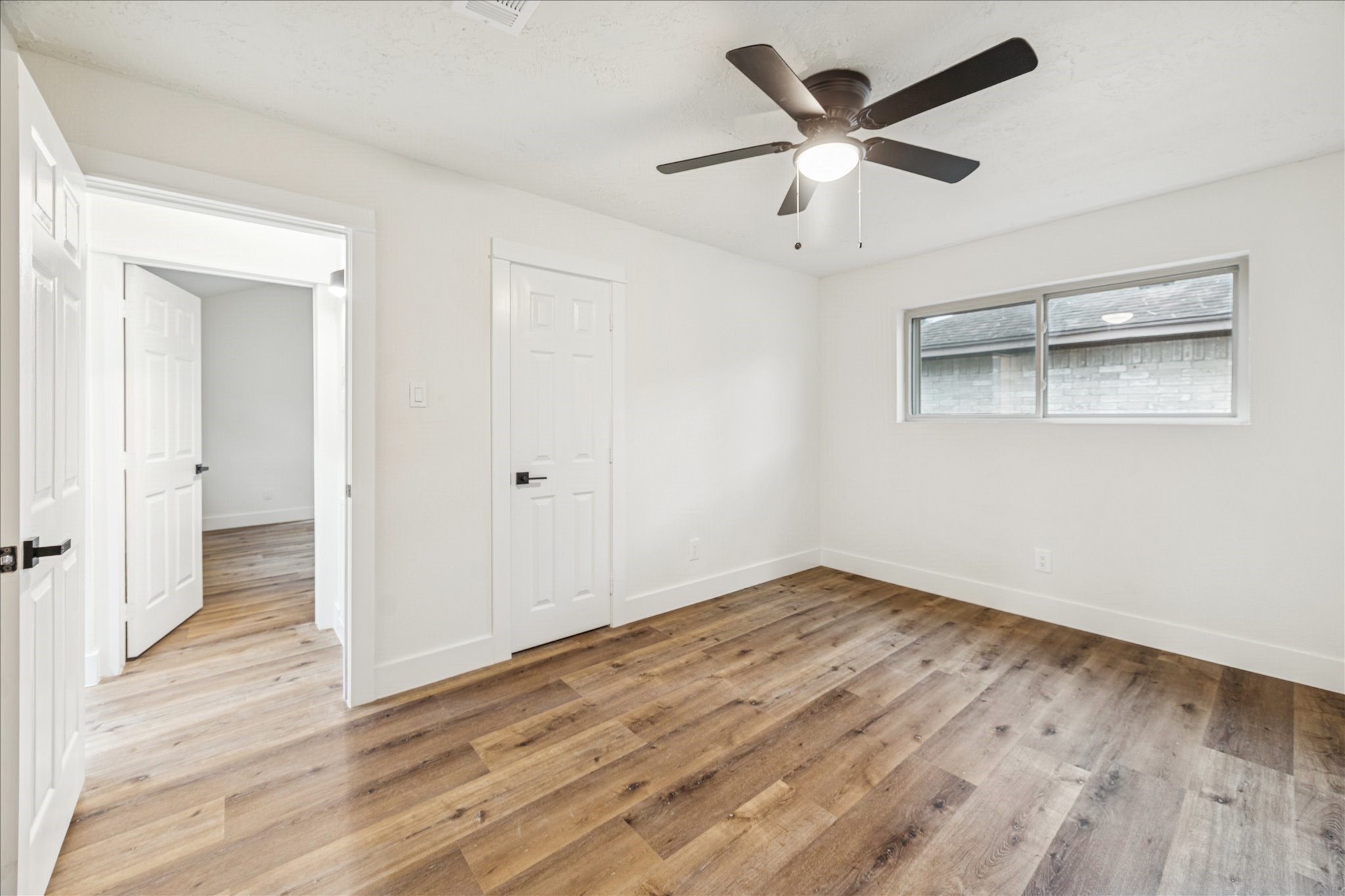 3623 Acorn Way Lane Spring, TX 77389 - Photo 16 of 22 an empty room with wooden floor and a ceiling fan
