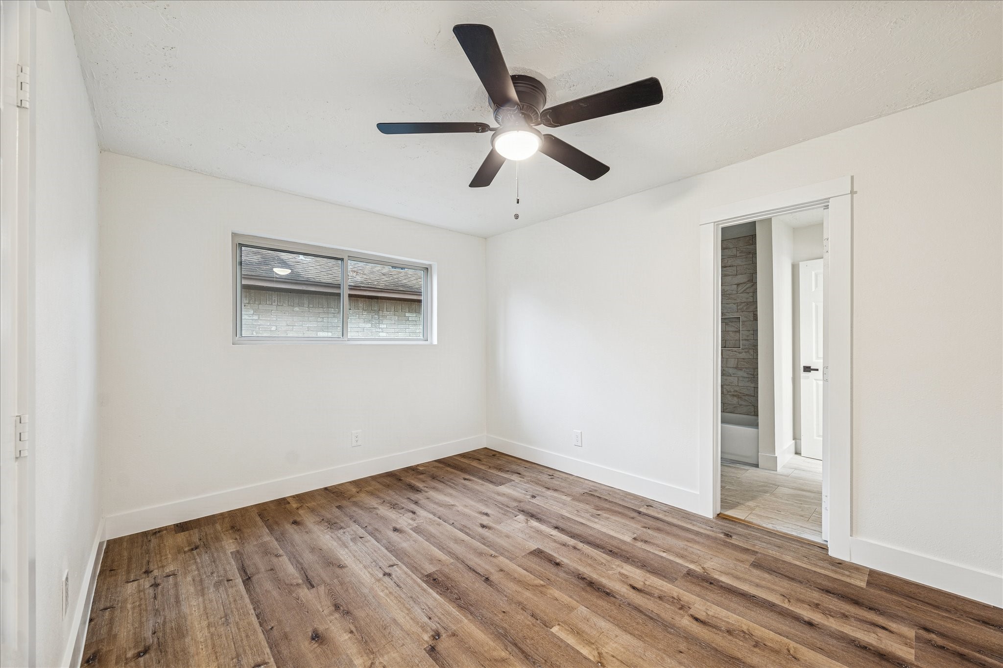 3623 Acorn Way Lane Spring, TX 77389 - Photo 17 of 22 a view of empty room with wooden floor and ceiling fan