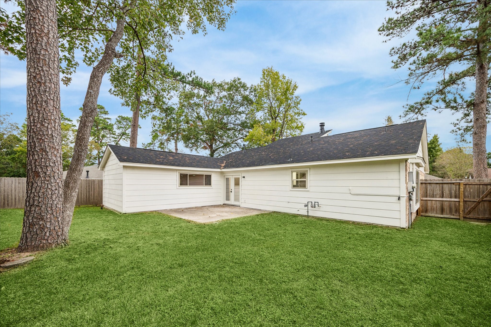 3623 Acorn Way Lane Spring, TX 77389 - Photo 21 of 22 a view of a house with a yard and a large tree