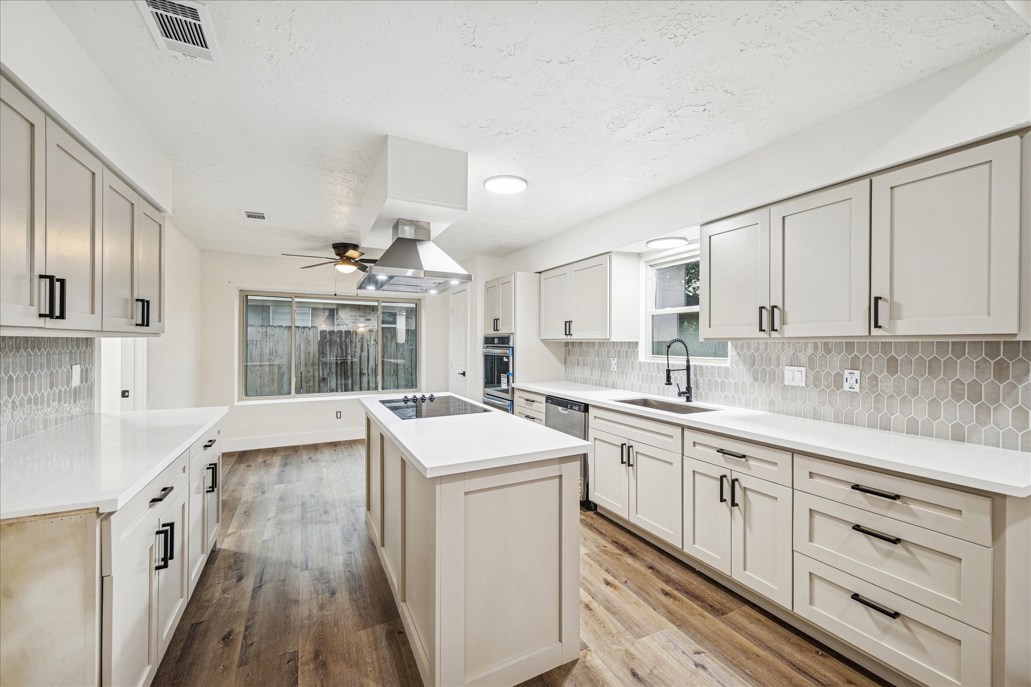 3623 Acorn Way Lane Spring, TX 77389 - Photo 7 of 22 a kitchen with a sink stove and cabinets