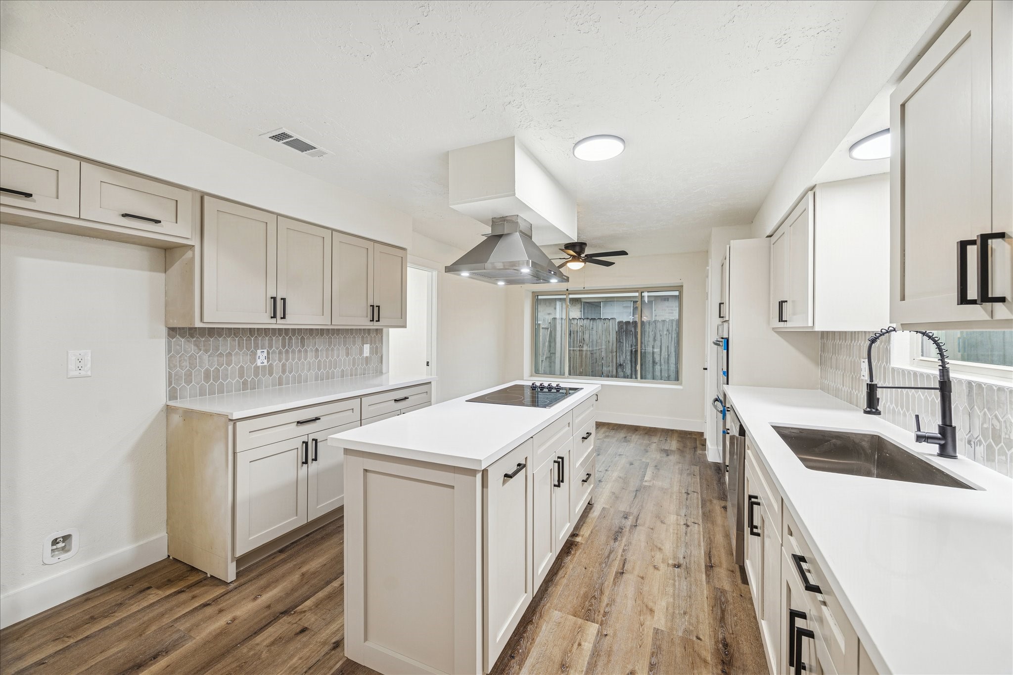 3623 Acorn Way Lane Spring, TX 77389 - Photo 8 of 22 a kitchen with a sink stove and cabinets