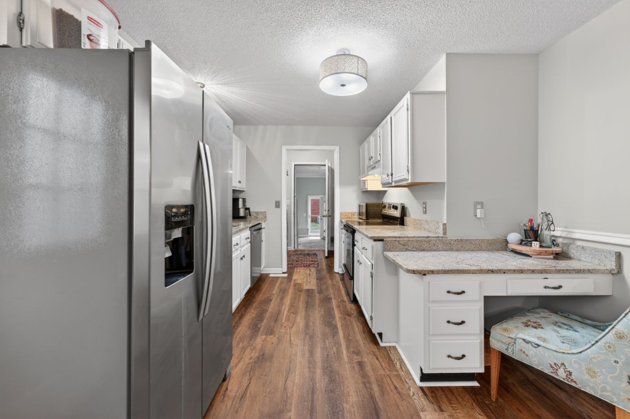 3740 Nicklaus Way Murfreesboro, TN 37128 - Photo 13 of 48 a kitchen with stainless steel appliances a refrigerator sink and cabinets