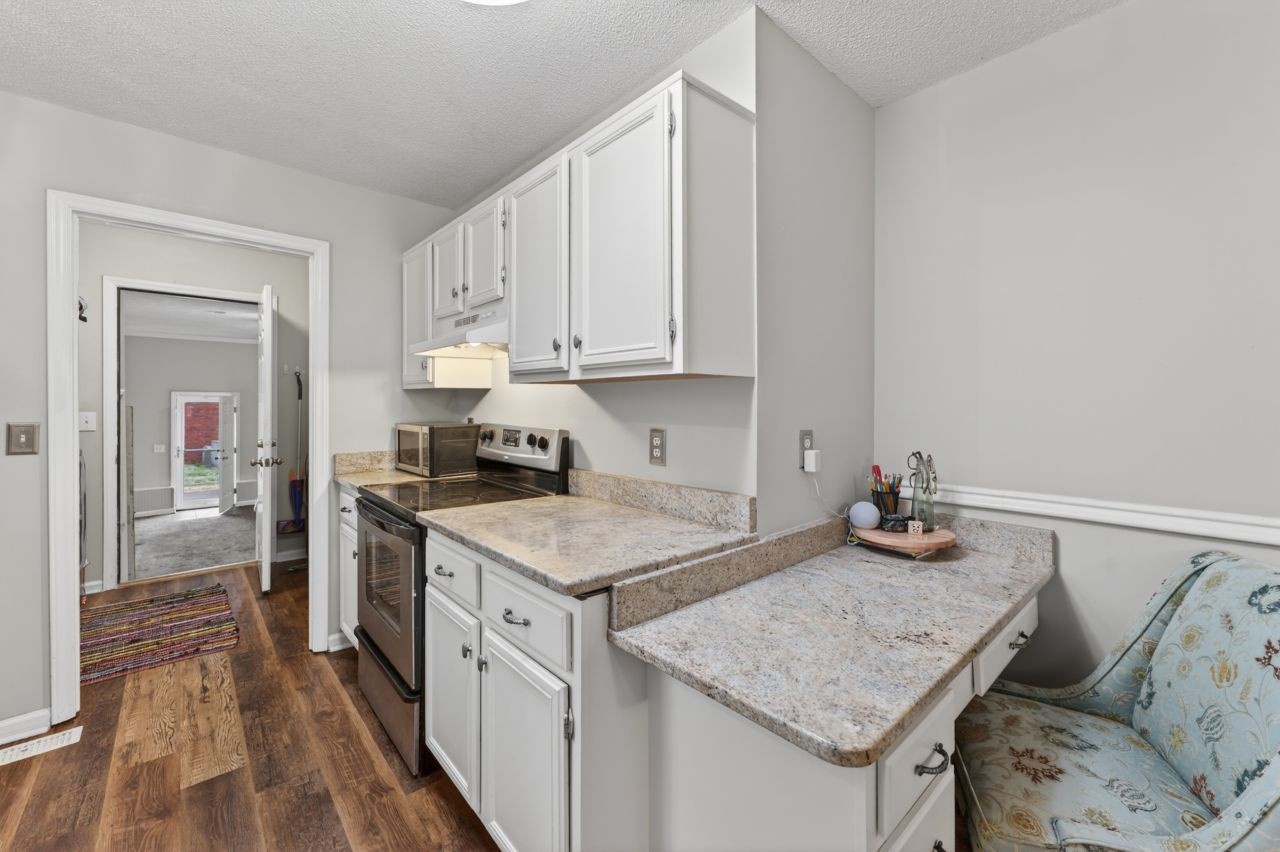 3740 Nicklaus Way Murfreesboro, TN 37128 - Photo 15 of 48 a kitchen that has a cabinets and a stove