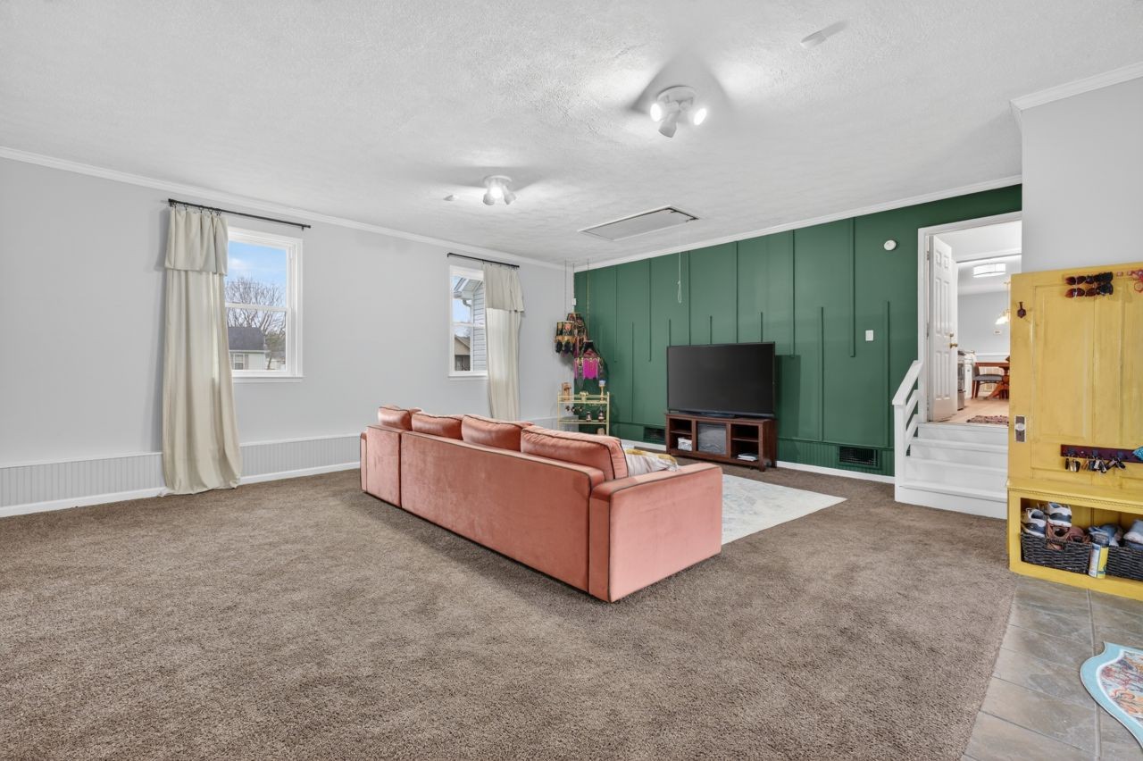 3740 Nicklaus Way Murfreesboro, TN 37128 - Photo 20 of 48 a living room with furniture and a flat screen tv