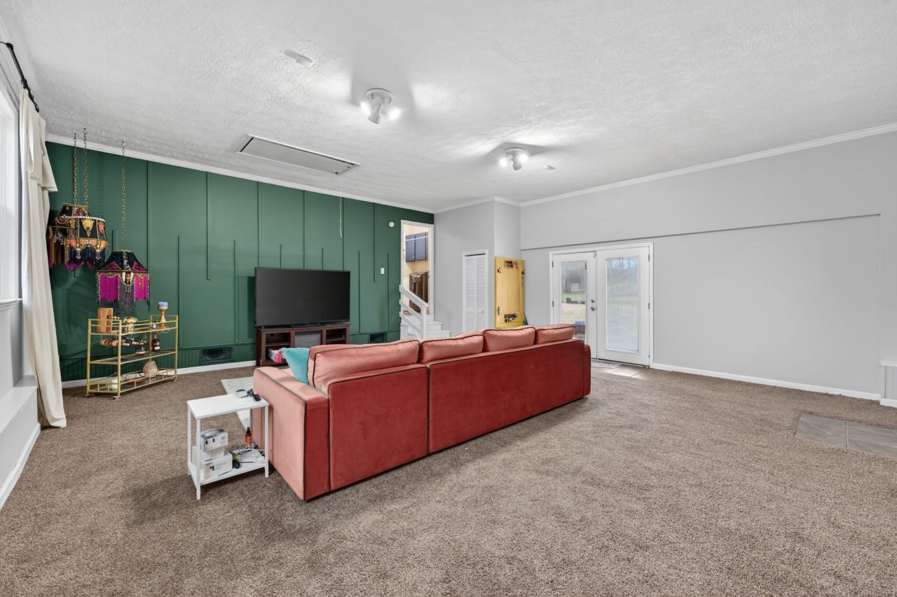 3740 Nicklaus Way Murfreesboro, TN 37128 - Photo 21 of 48 a living room with furniture and a flat screen tv