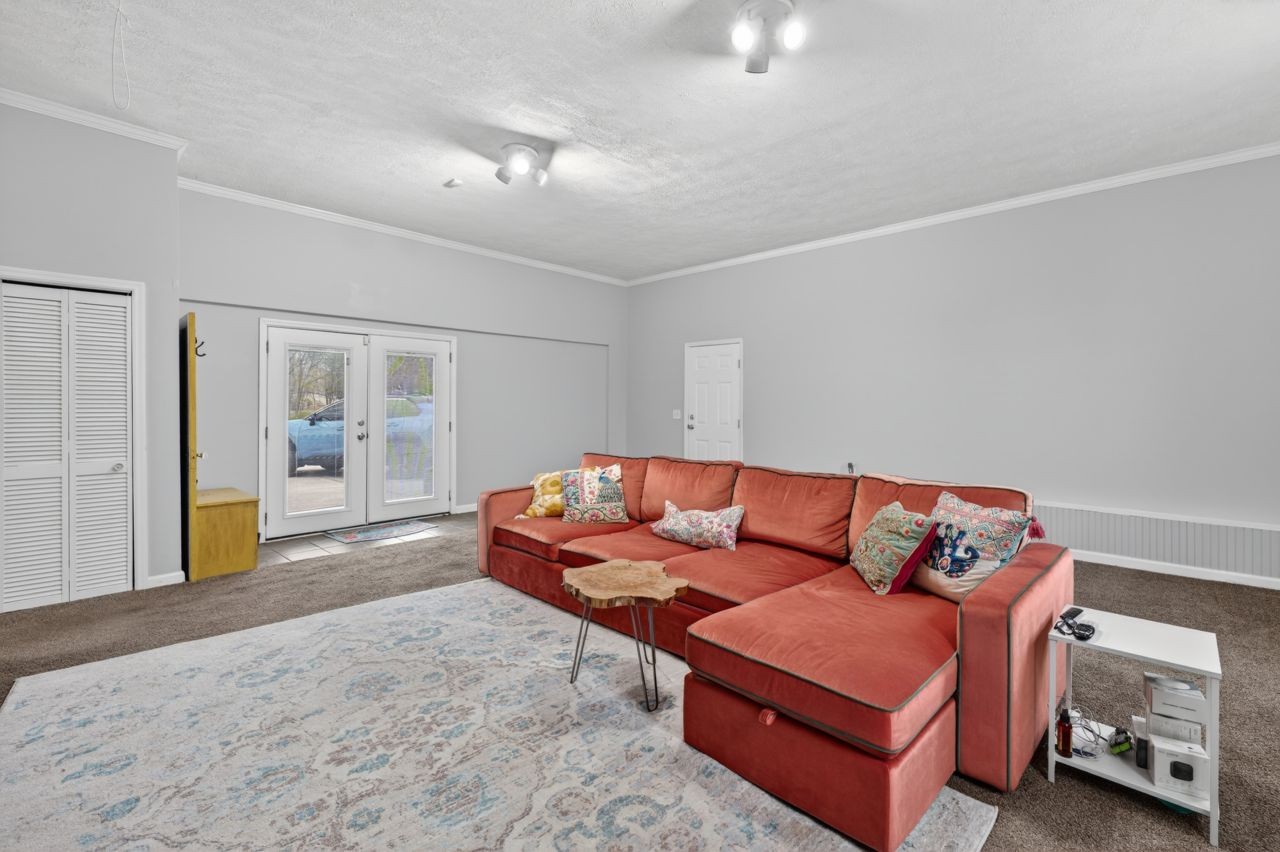 3740 Nicklaus Way Murfreesboro, TN 37128 - Photo 22 of 48 a blue couch sitting in a living room next to a window