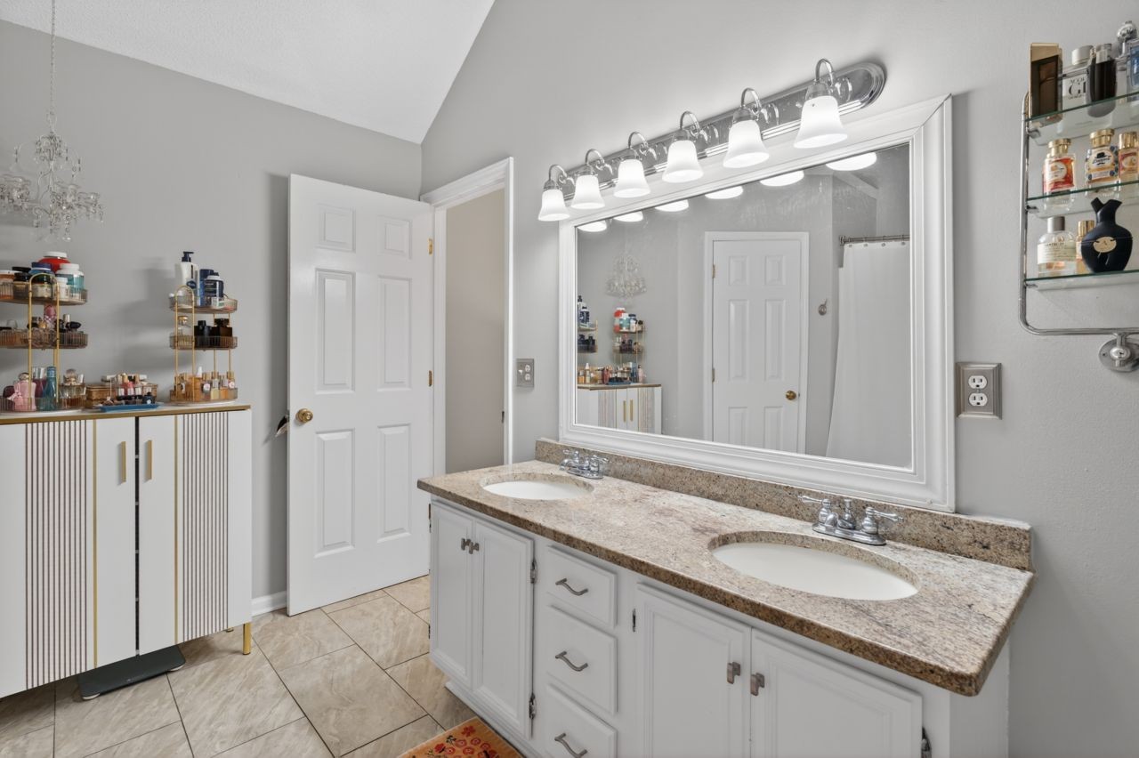 3740 Nicklaus Way Murfreesboro, TN 37128 - Photo 30 of 48 a bathroom with a granite countertop sink and a mirror