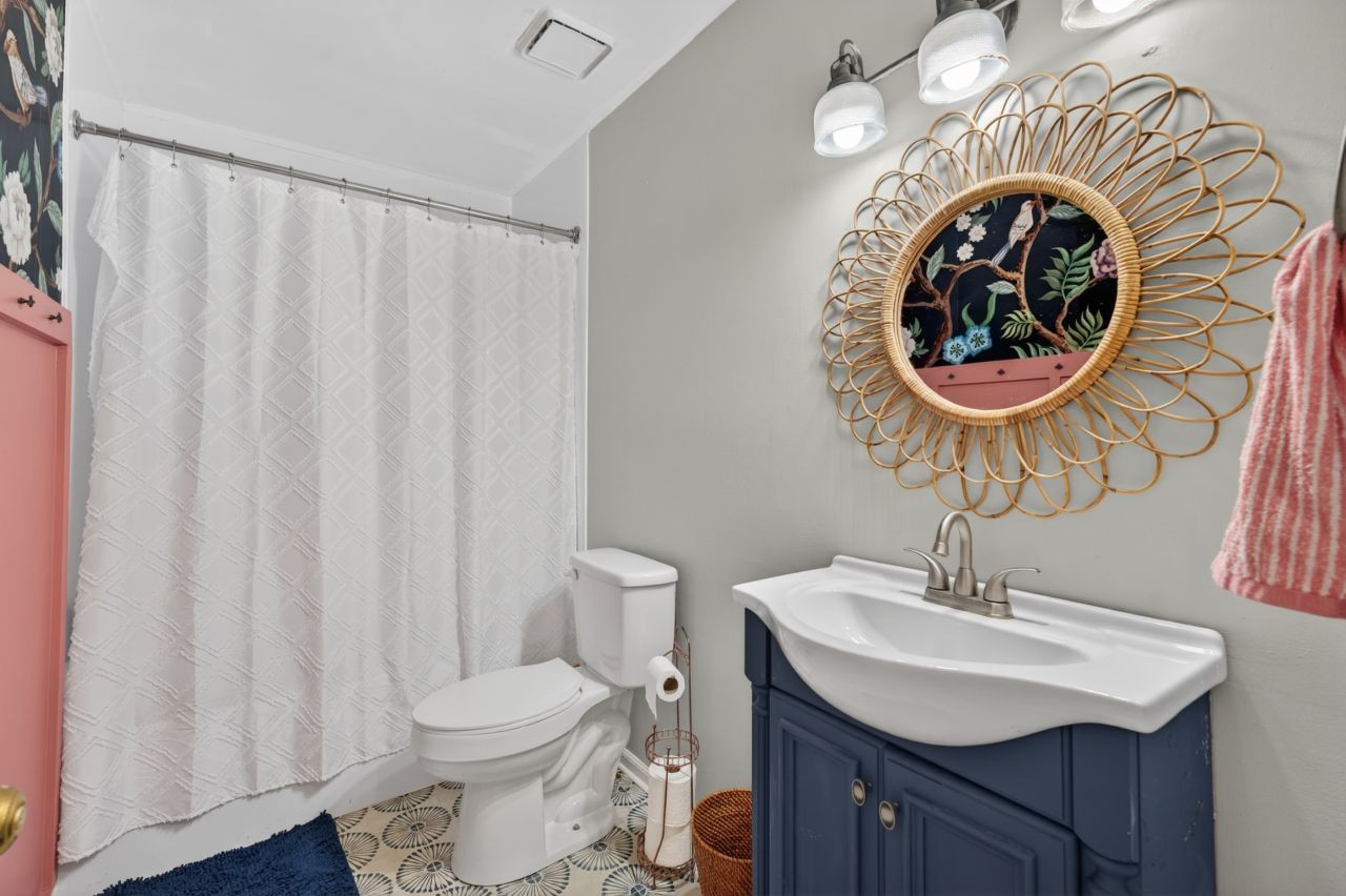 3740 Nicklaus Way Murfreesboro, TN 37128 - Photo 34 of 48 a bathroom with a sink a toilet and a mirror