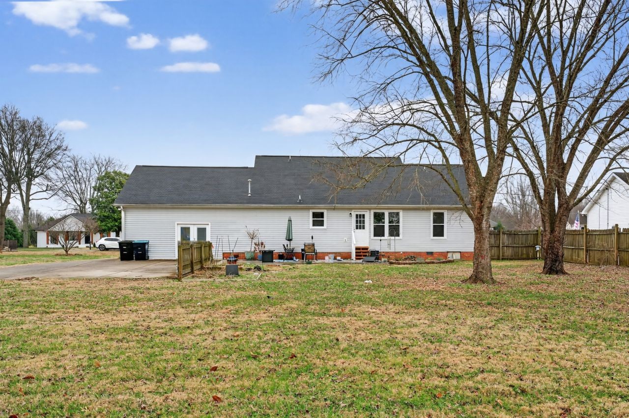 3740 Nicklaus Way Murfreesboro, TN 37128 - Photo 39 of 48 a front view of a house with a yard and trees