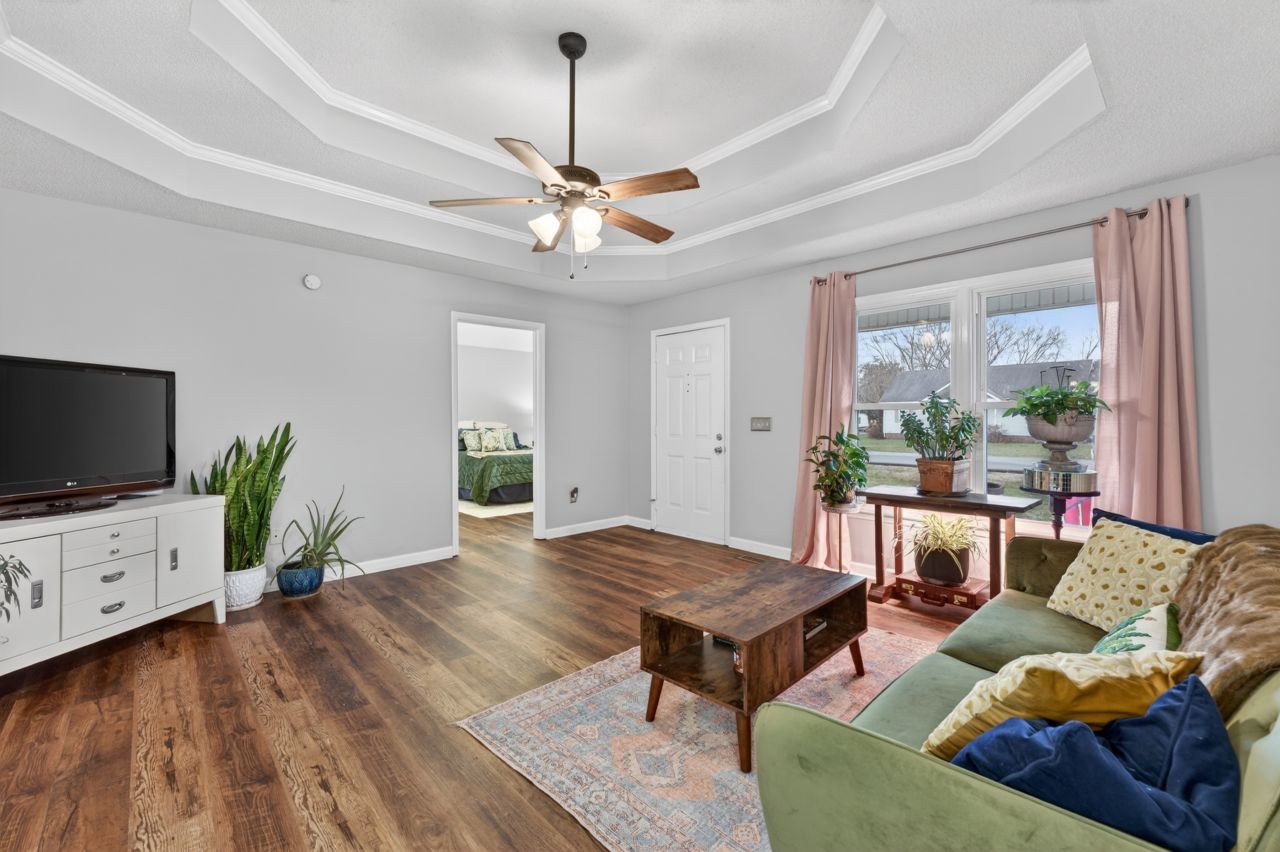 3740 Nicklaus Way Murfreesboro, TN 37128 - Photo 5 of 48 a living room with furniture a flat screen tv and a window