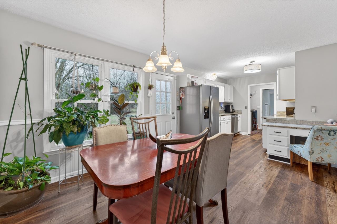 3740 Nicklaus Way Murfreesboro, TN 37128 - Photo 10 of 48 a view of a dining room with furniture window and wooden floor