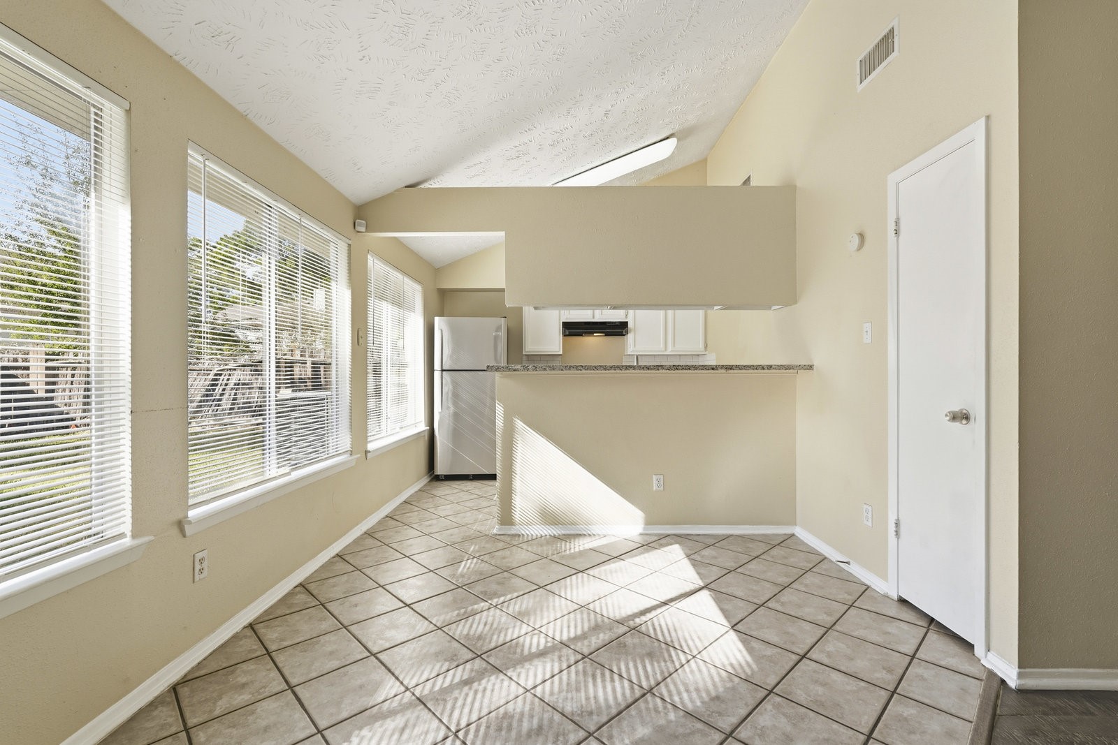 16235 Cutten Road Houston, TX 77070 - Photo 12 of 25 a view of a kitchen with windows and white doors