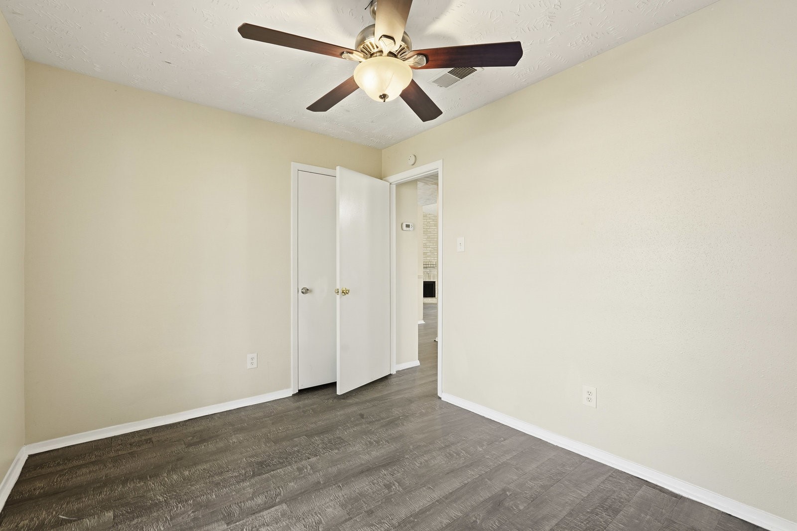 16235 Cutten Road Houston, TX 77070 - Photo 25 of 25 an empty room with a window and a fan