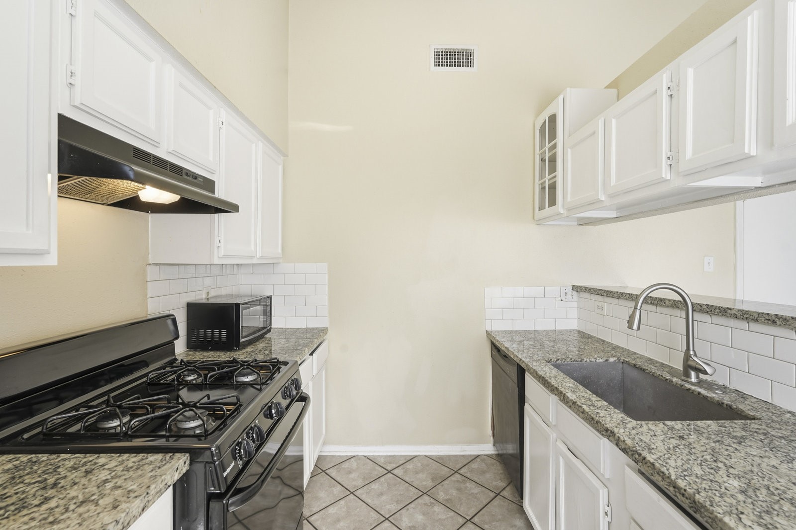 16235 Cutten Road Houston, TX 77070 - Photo 10 of 25 a kitchen with stainless steel appliances granite countertop a sink stove and cabinets