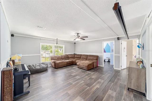 a living room with furniture and a window
