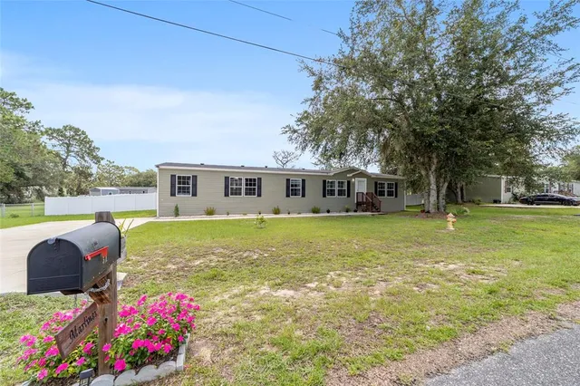 a front view of house with an outdoor space and seating