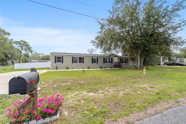 a front view of house with an outdoor space and seating