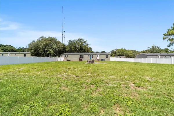 a view of a lake with a big yard