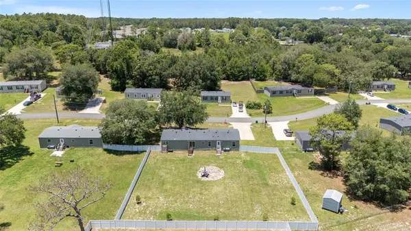 a view of a swimming pool with a yard