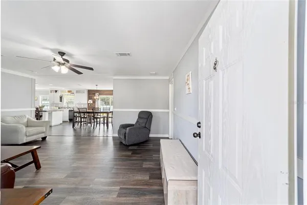 a view of kitchen and dining room with wooden floor