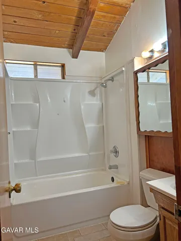 a bathroom with a toilet a sink and bathtub