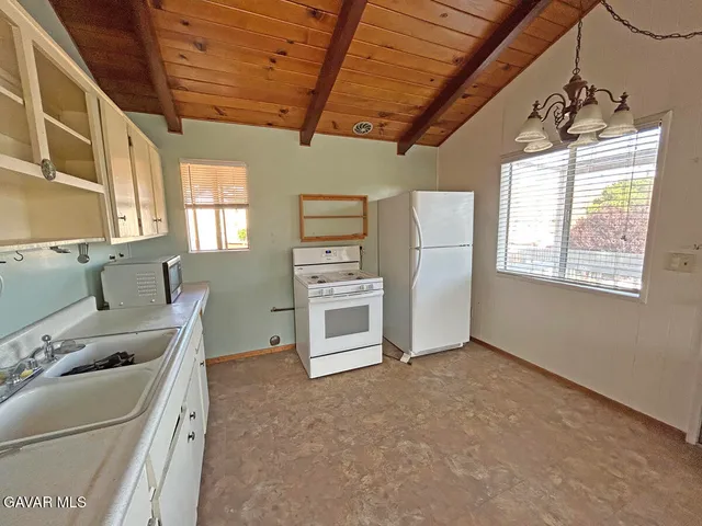 a kitchen with furniture and window