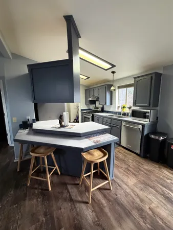 wooden floor with a window in a room