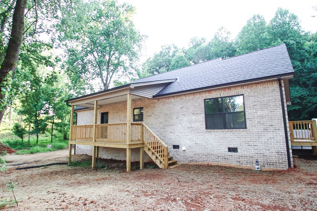 329 Webb Drive Sparta, TN 38583 - Photo 17 of 17 a view of a house with a yard and sitting area
