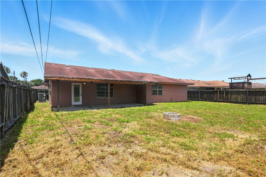 833 Orleans Drive Corpus Christi, TX 78418 - Photo 14 of 18 a view of a house with backyard and porch