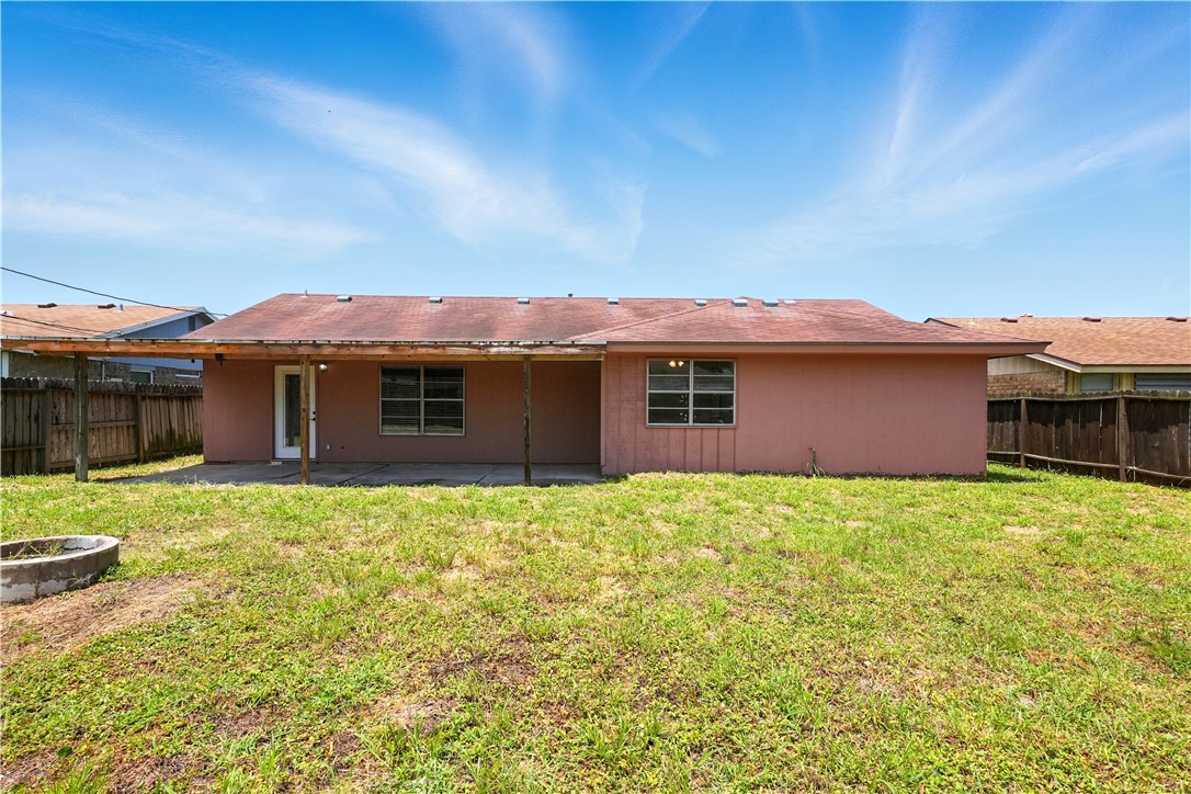 833 Orleans Drive Corpus Christi, TX 78418 - Photo 15 of 18 a view of a house with a big yard and potted plants