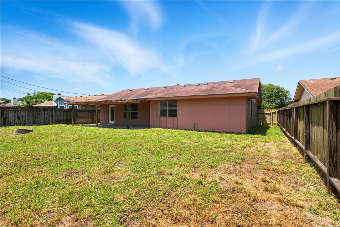 833 Orleans Drive Corpus Christi, TX 78418 - Photo 16 of 18 a view of a house with a backyard